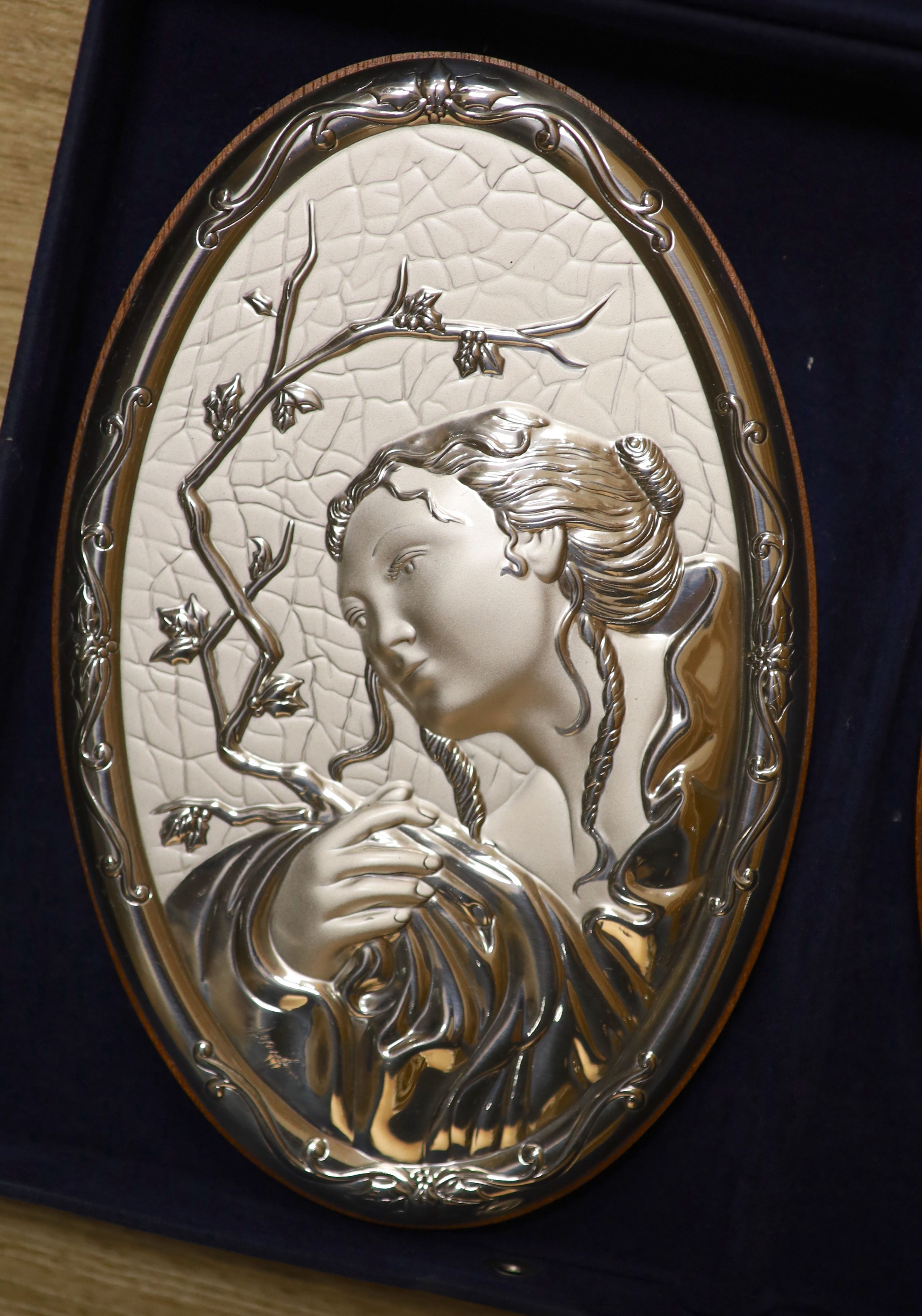 A cased set of four modern Italian repousse 850 white metal mounted 'The Four Seasons' wall plaques, 20.4cm.